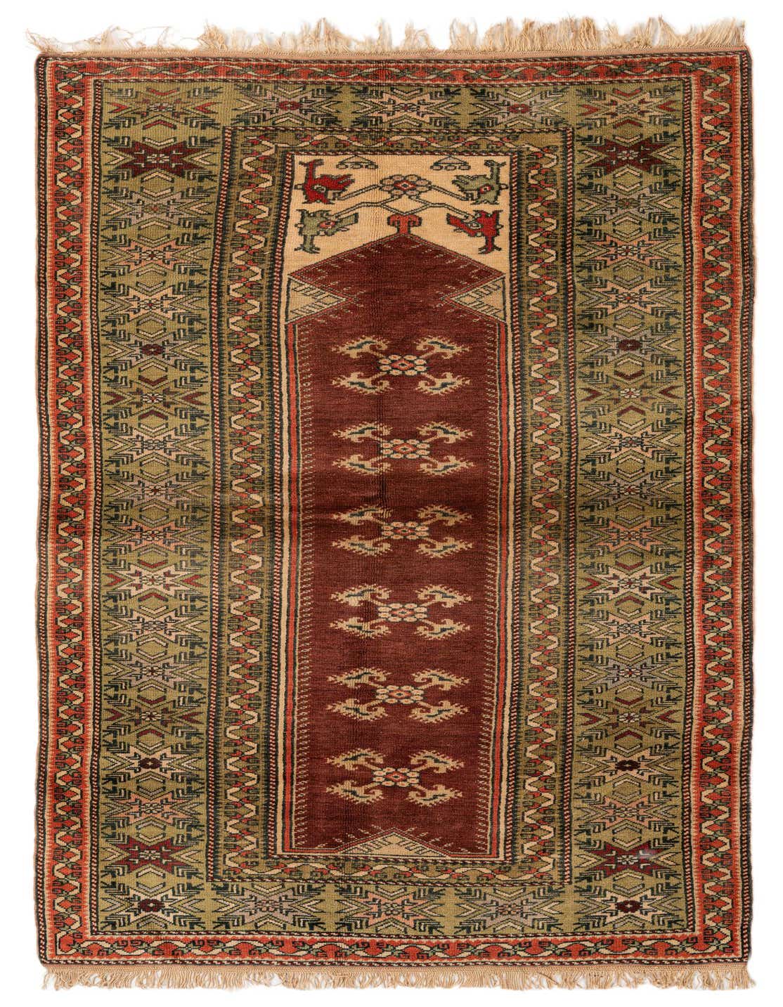 A 5x7 rectangular Kars tribal wool rug with a central red panel, surrounded by olive green and orange geometric patterns, and fringed ends.