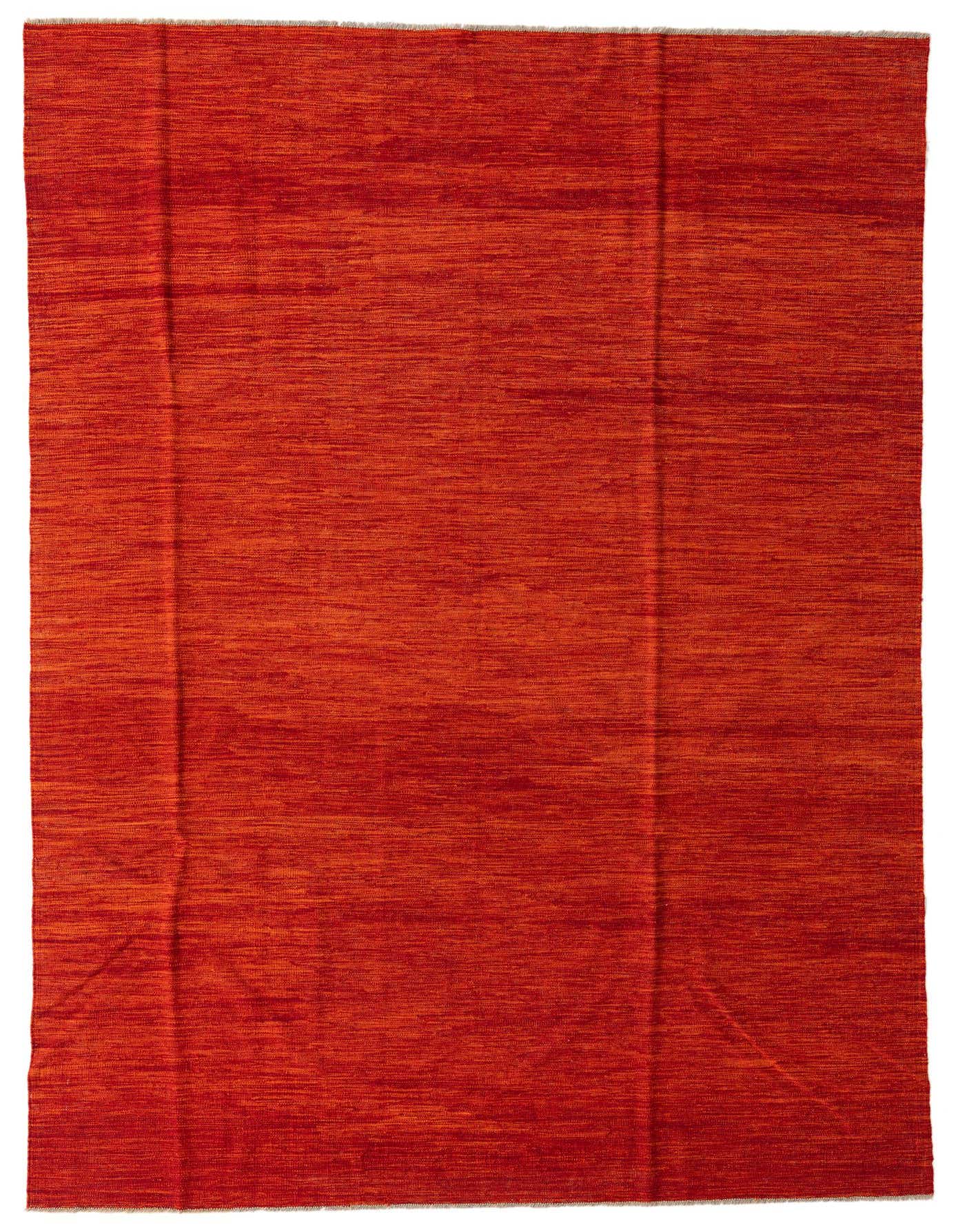 A 7x10 rectangular flatweave wool rug in vibrant shades of orange and red, featuring a subtle tribal-modern abstract pattern.