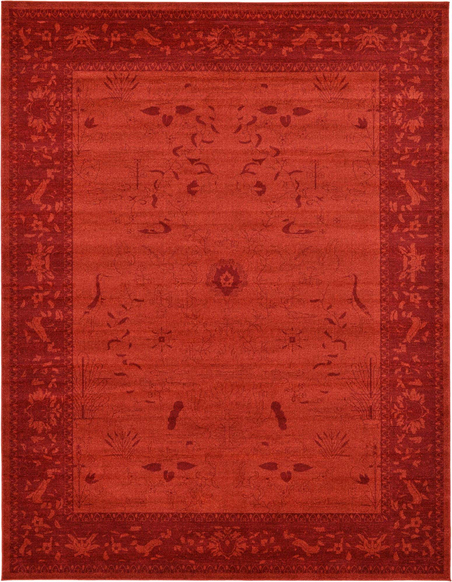A 10x13 rectangular Miranda rug in shades of orange and red, featuring a traditional floral pattern and a distinct border.