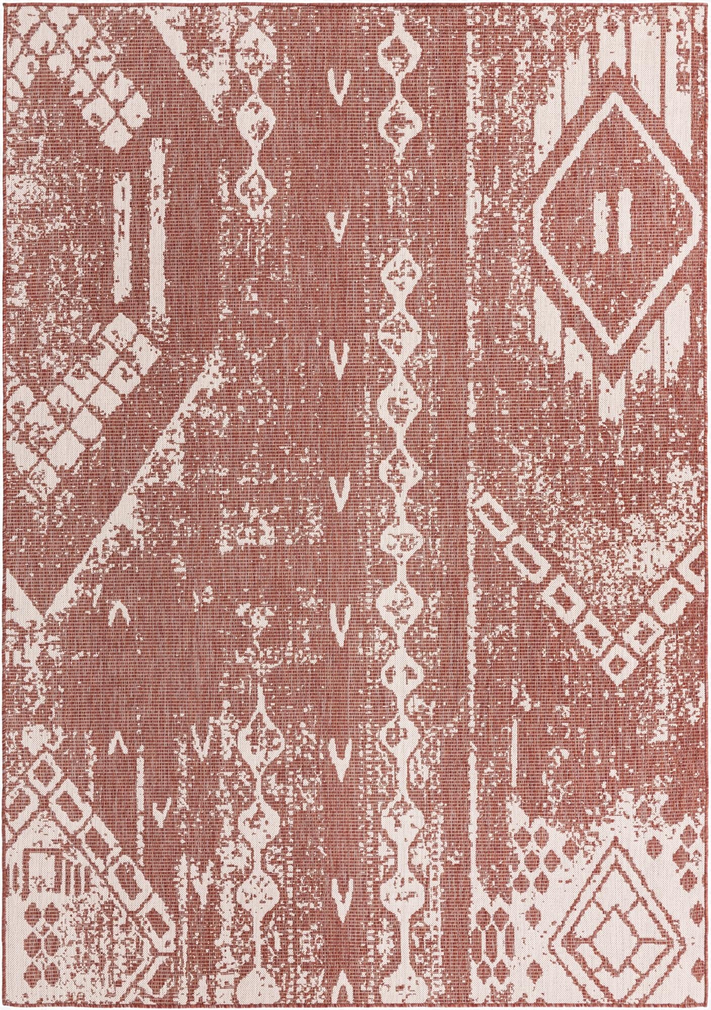 A 7x10 rectangular indoor/outdoor rug featuring a distressed bohemian pattern in burnt orange and off-white.