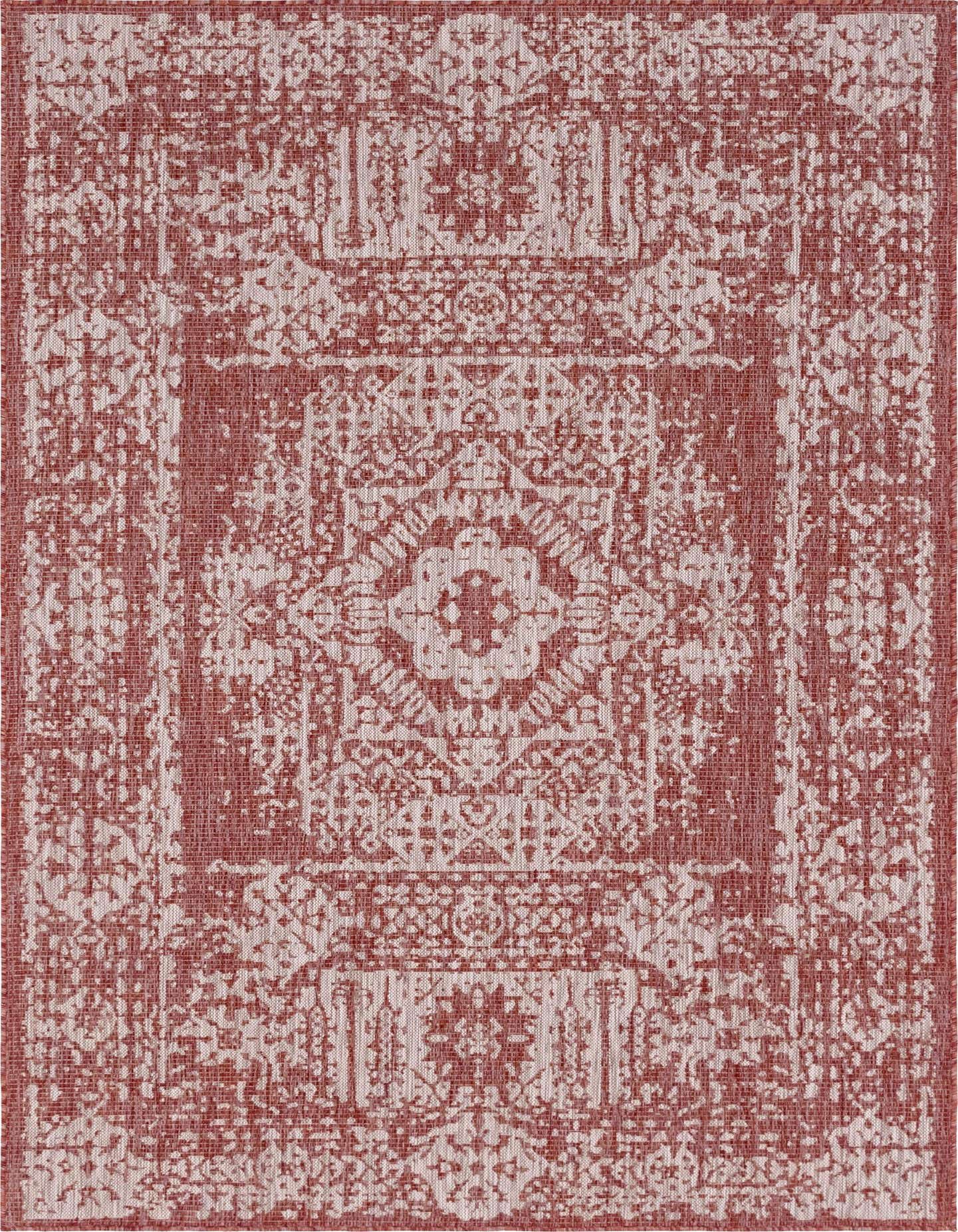 A 7x10 rectangular indoor/outdoor rug featuring a distressed Southwestern medallion pattern in shades of orange and red.