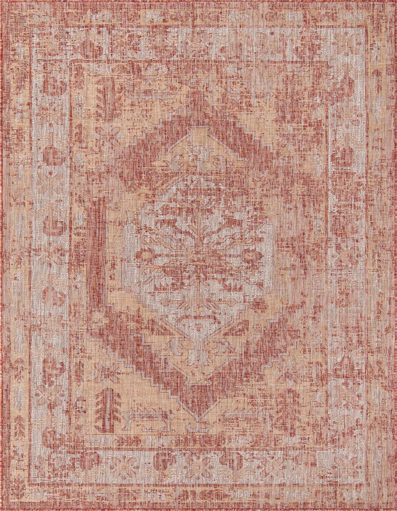 A 6x9 rectangular indoor/outdoor rug featuring a distressed Southwestern pattern in shades of orange and red.