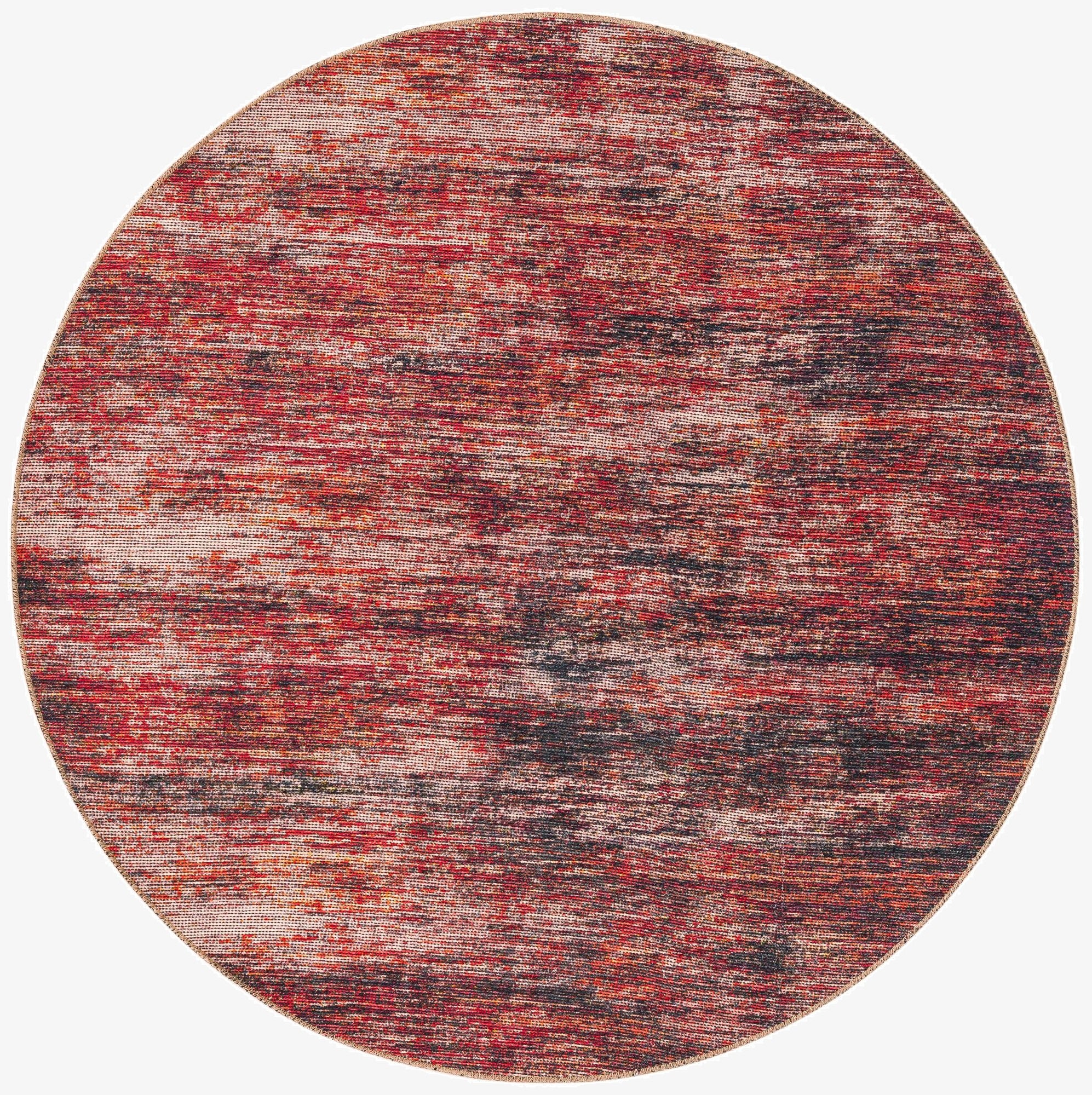 A 5' round modern rug featuring a textured, abstract stripe pattern in shades of orange and red.