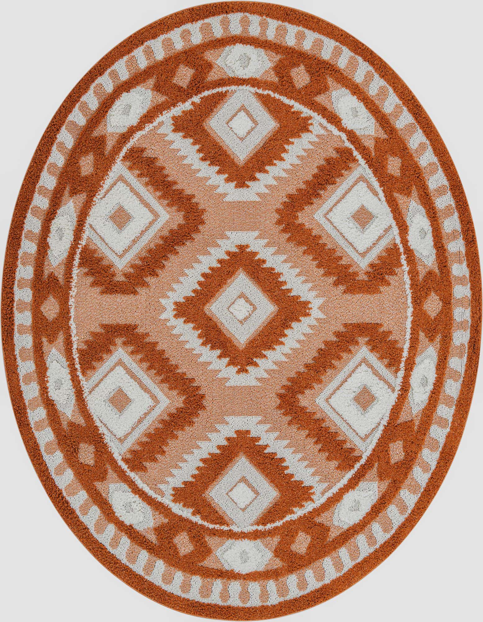 A round orange and white Southwestern-style rug with a tribal geometric pattern, featuring diamond shapes and a textured pile.