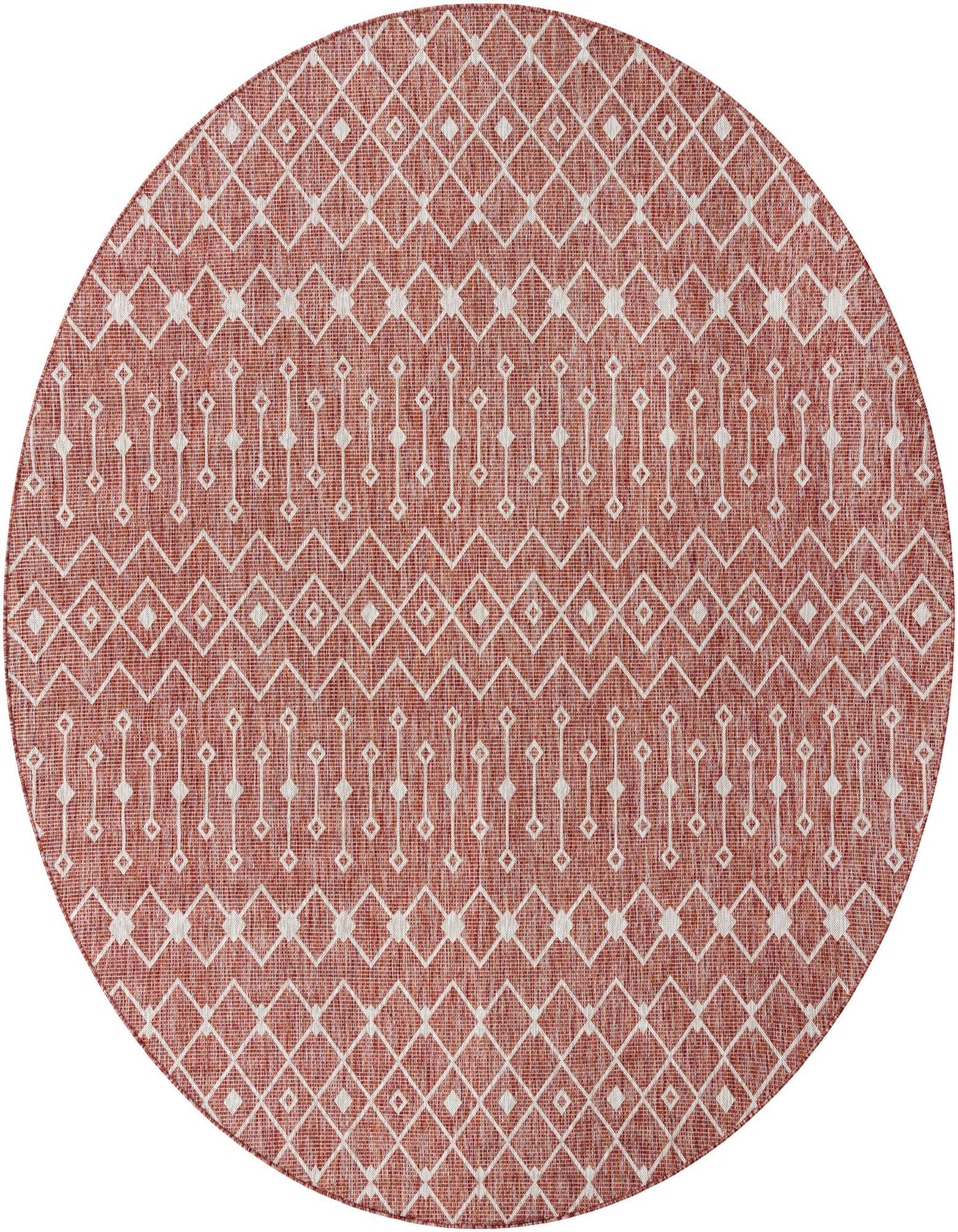 A large round orange and red tribal patterned indoor/outdoor rug with white geometric designs.