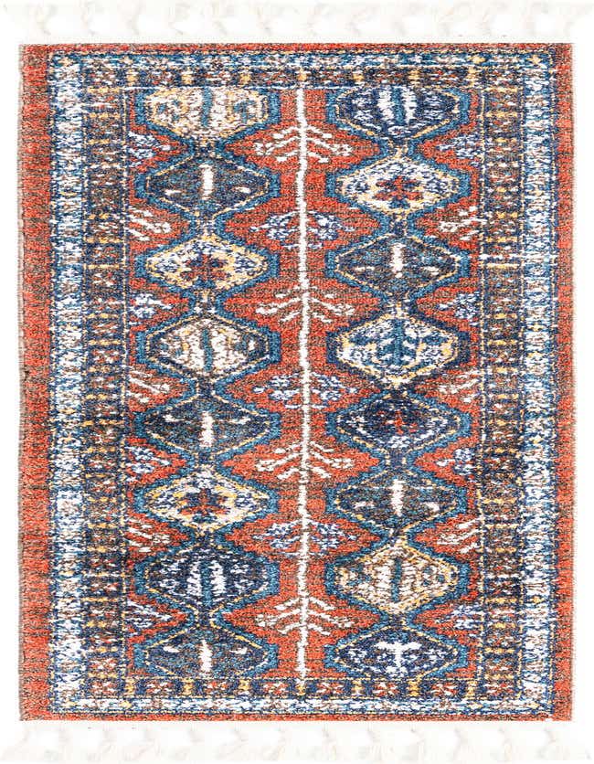 A 6 ft runner rug with a modern striped pattern in oranges, reds, blues, and white, featuring decorative tassels.