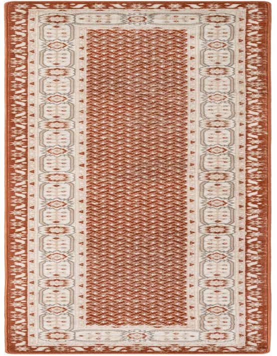 A 10 ft runner rug in shades of orange and red with a modern geometric pattern and a decorative border, ideal for a hallway.