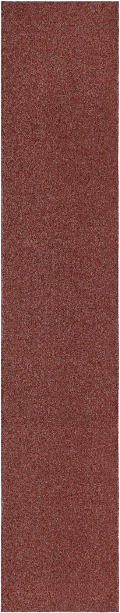 A long 13 ft runner rug in a solid burnt orange and red blend, featuring a thin, modern texture.
