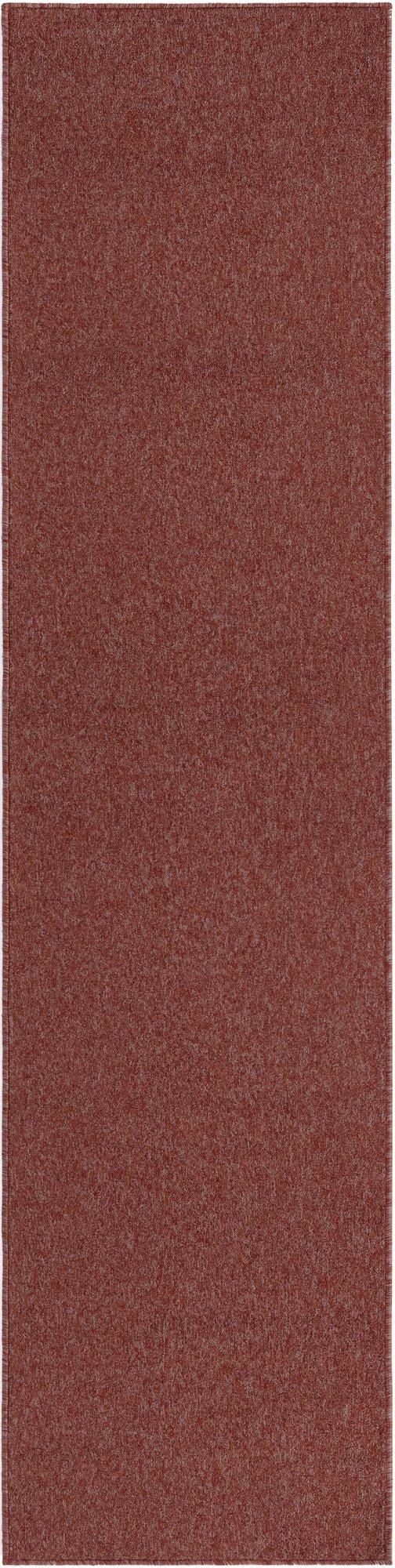 A 10 ft runner rug from the Rugs.com Everyday Solid collection, featuring a thin pile and a solid modern pattern in a blend of orange and red hues, ideal for hallways.