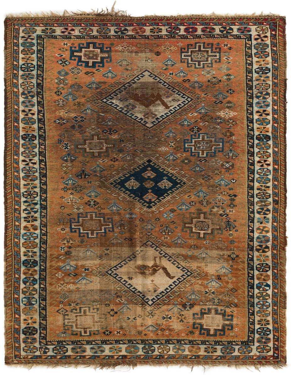 A 9 ft Hamedan runner rug in oranges and reds, featuring traditional Persian tribal patterns with a central medallion.
