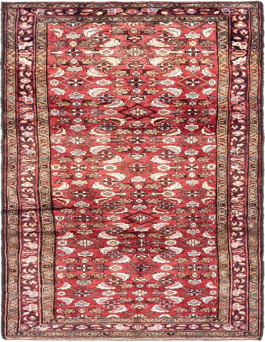 A 10 ft runner rug in traditional Persian style, featuring a rich red and orange field with intricate tribal patterns and a dark border.