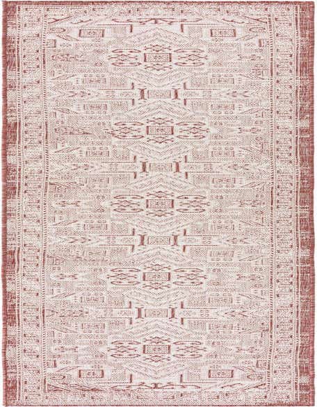 A 12 ft runner rug from the Rugs.com Outdoor Aztec collection, featuring a Southwestern tribal pattern in shades of orange and red.