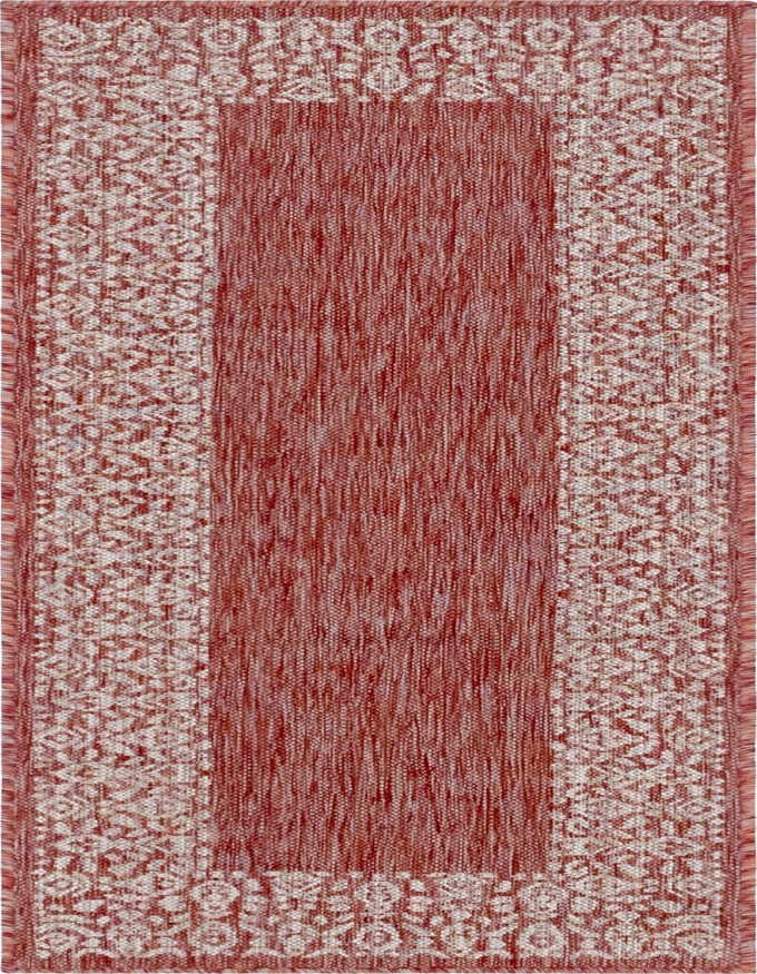 A 6 ft runner rug in shades of orange and red with a subtle textured pile and a traditional border pattern.