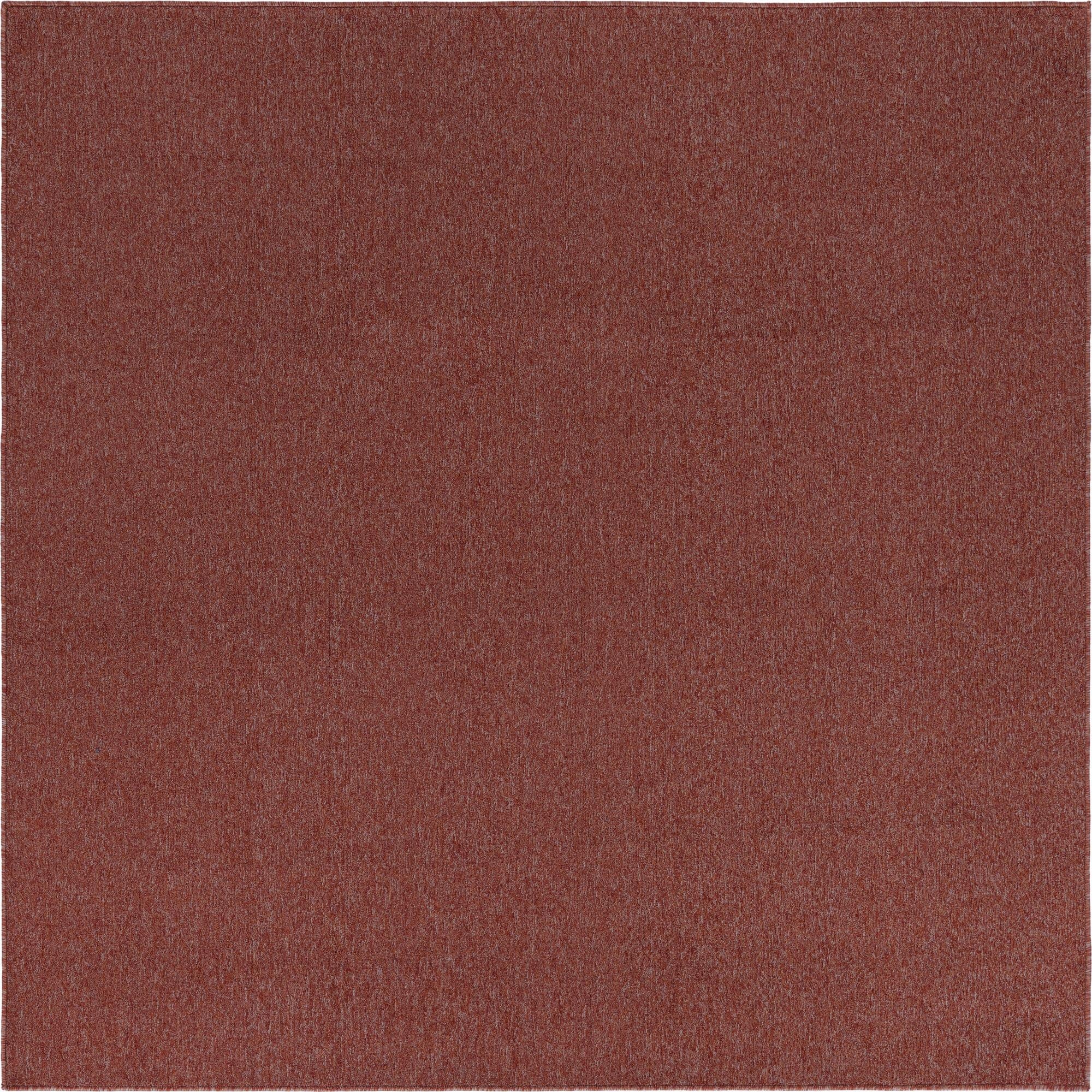 A 7'x7' square modern solid orange and red polypropylene rug with a thin pile, suitable for indoor use.