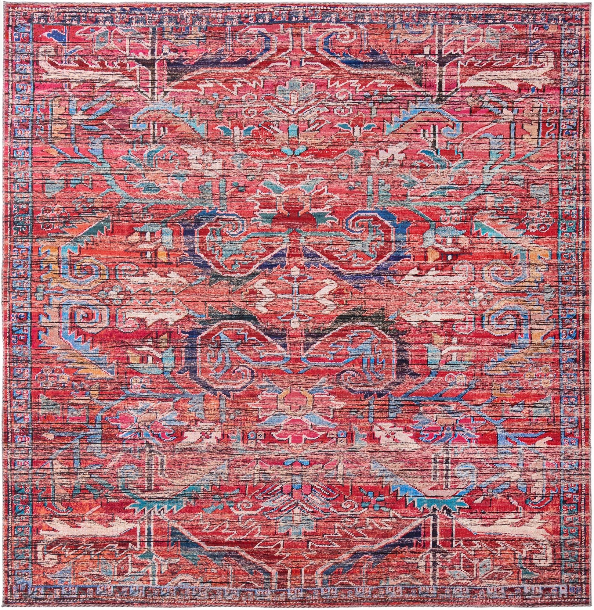 A 10' 6 x 10' 6 square Maahru rug featuring a distressed traditional tribal pattern in vibrant oranges, reds, blues, and creams.