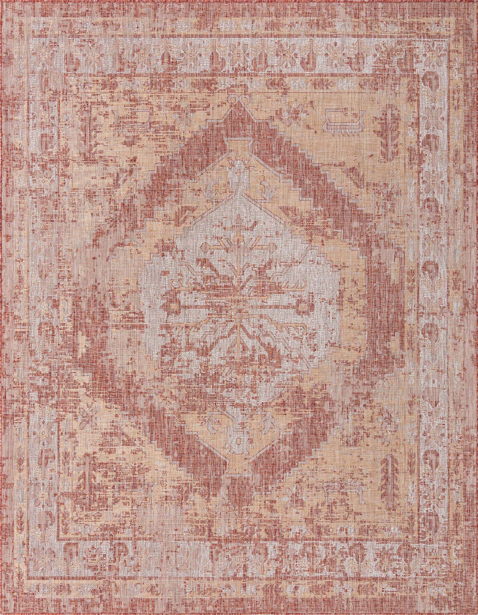 A 13' square indoor/outdoor rug featuring a distressed Southwestern pattern in shades of orange and red.