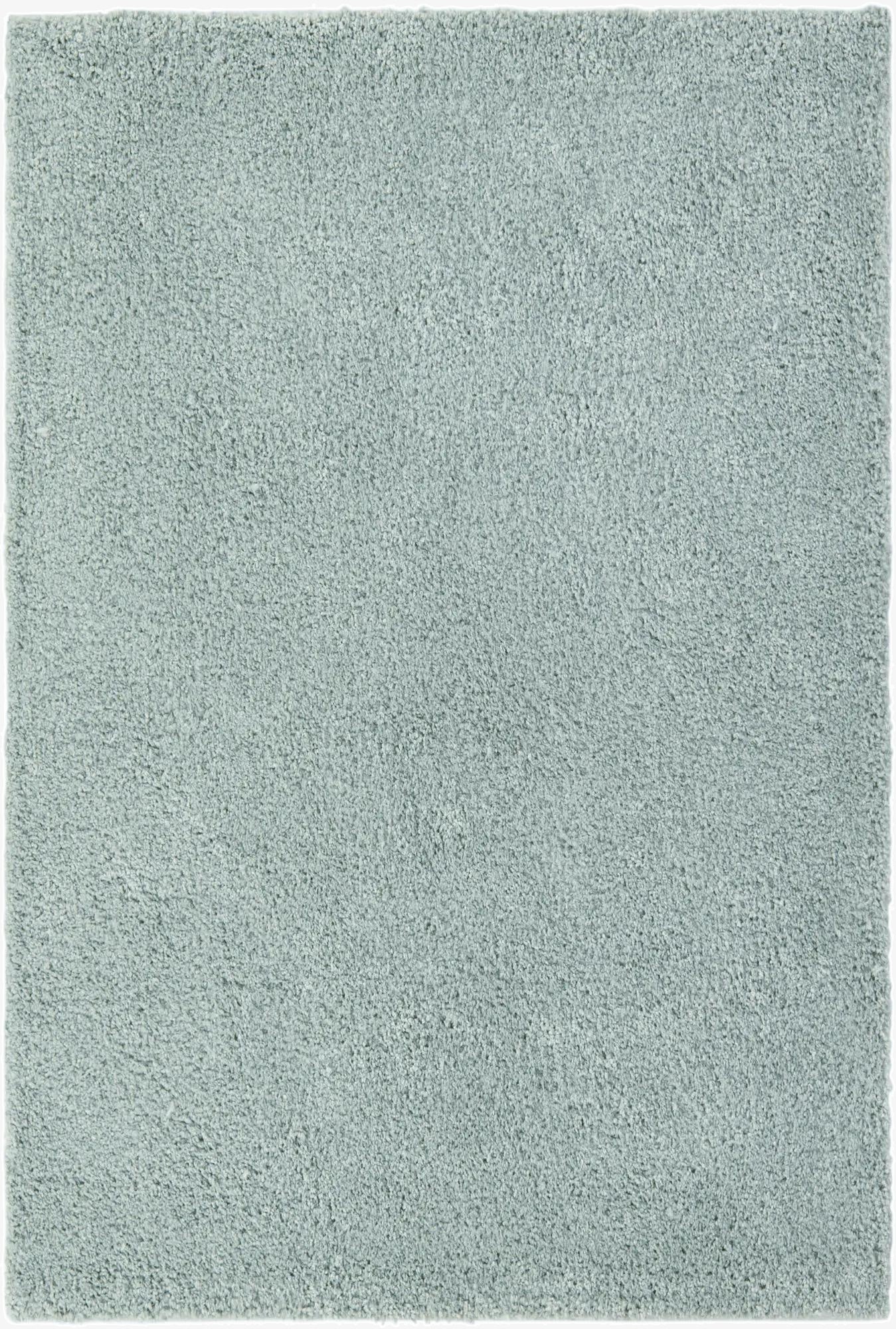A 6x9 rectangular Soft Solid Shag rug in a light green hue, featuring a plush, textured pile.