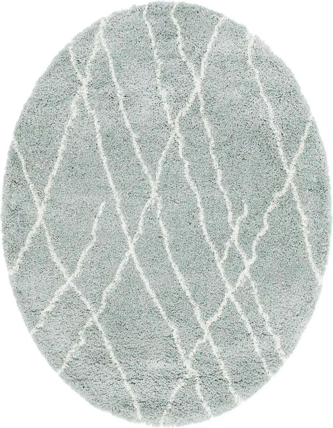 A 5' 3 round green shag rug with a white tribal diamond pattern, ideal for an indoor living space.
