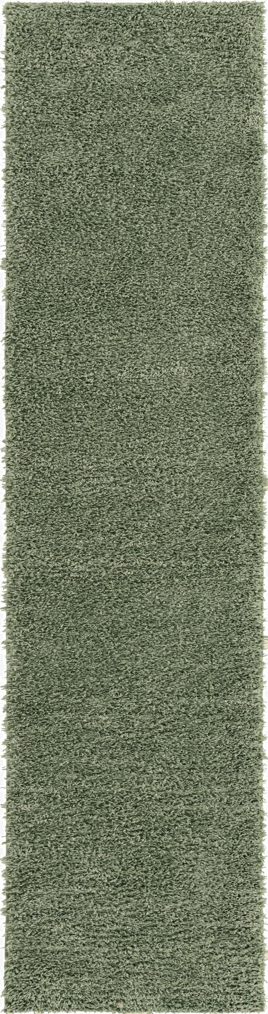 A soft, plush Zermatt Shag 10 Ft Runner rug in a solid sage green color, ideal for a hallway.