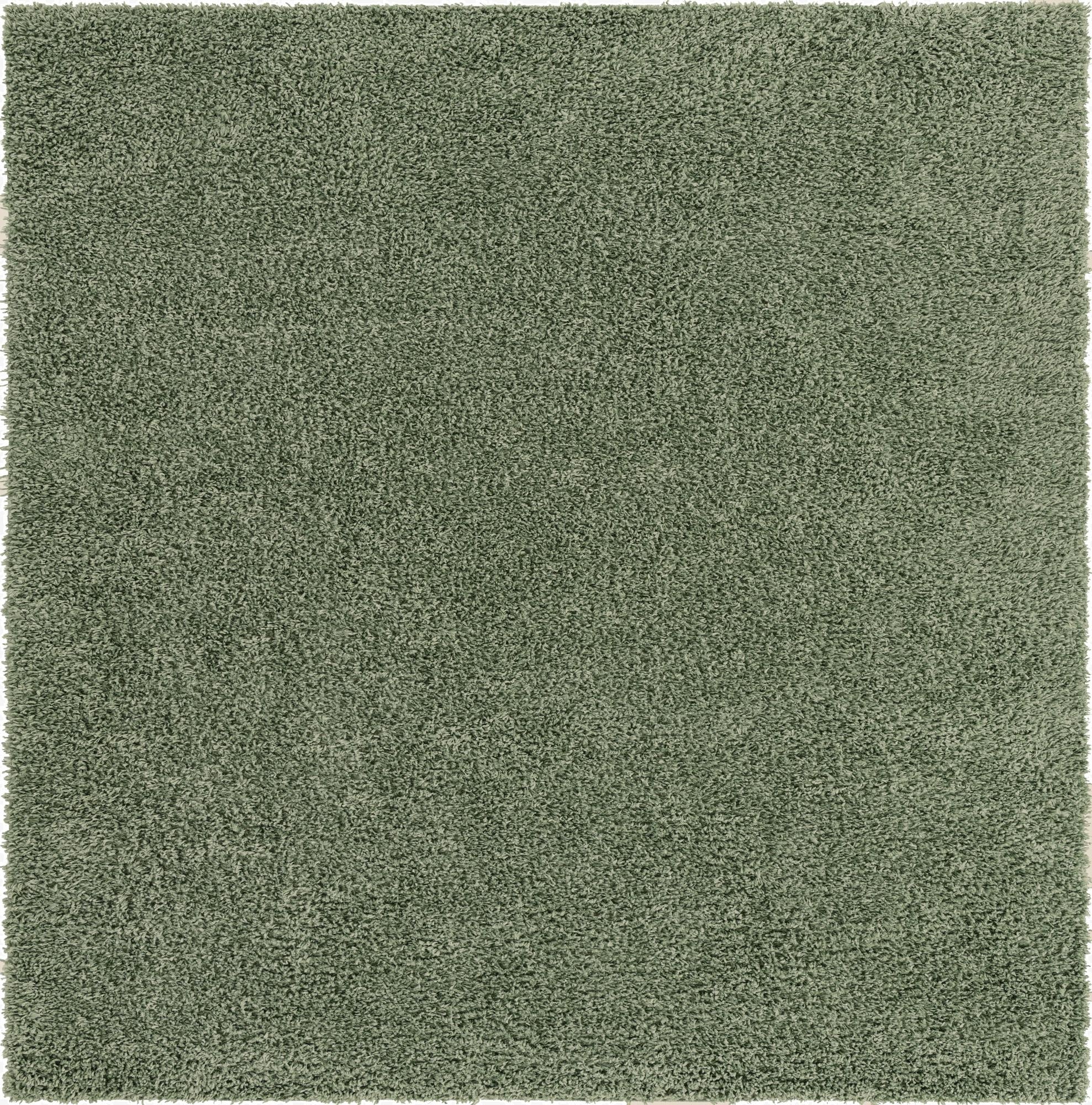 A soft, plush 3'x3' square green shag rug, perfect for adding comfort and texture to any indoor space.