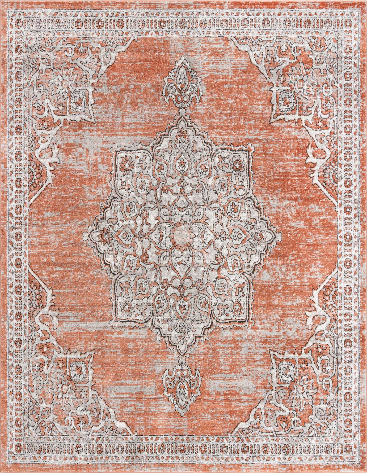 A 10'x10' square Nyla rug from Rugs.com, featuring a faded orange and pink traditional medallion pattern with a textured pile.