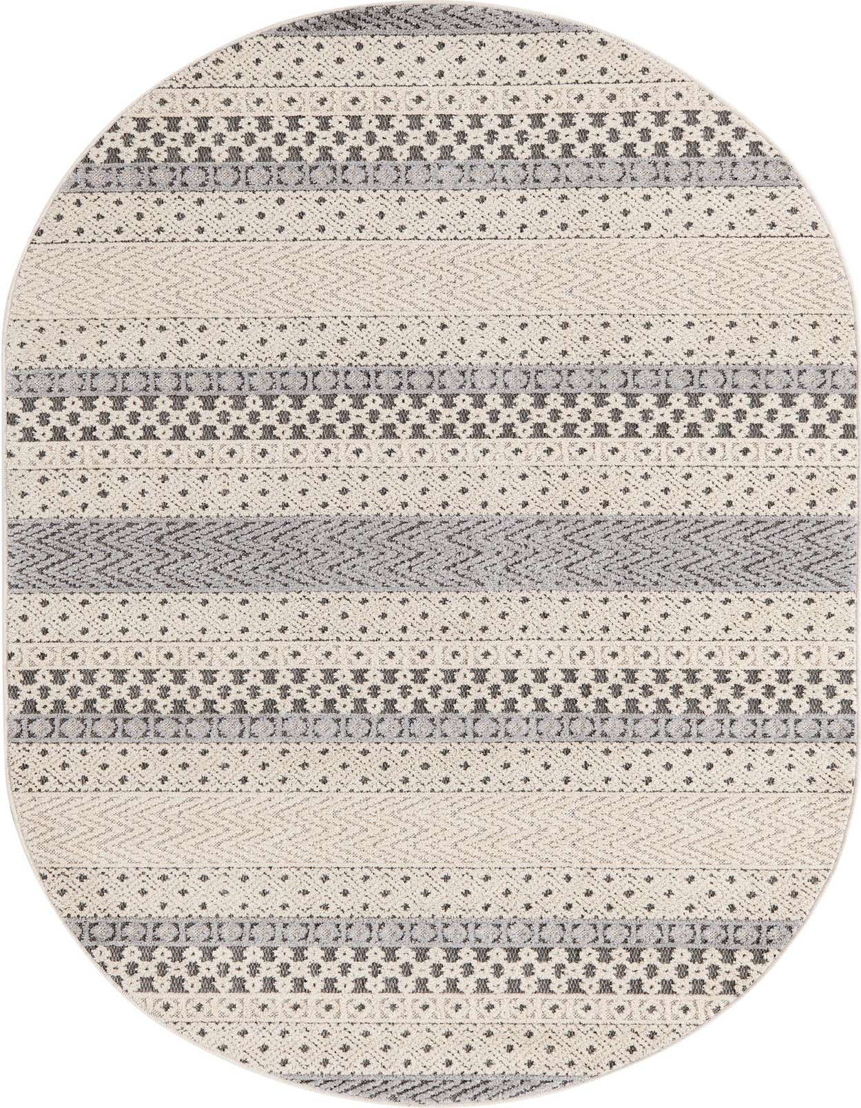 An oval ivory and gray modern area rug featuring varied striped patterns and a high/low textured pile.