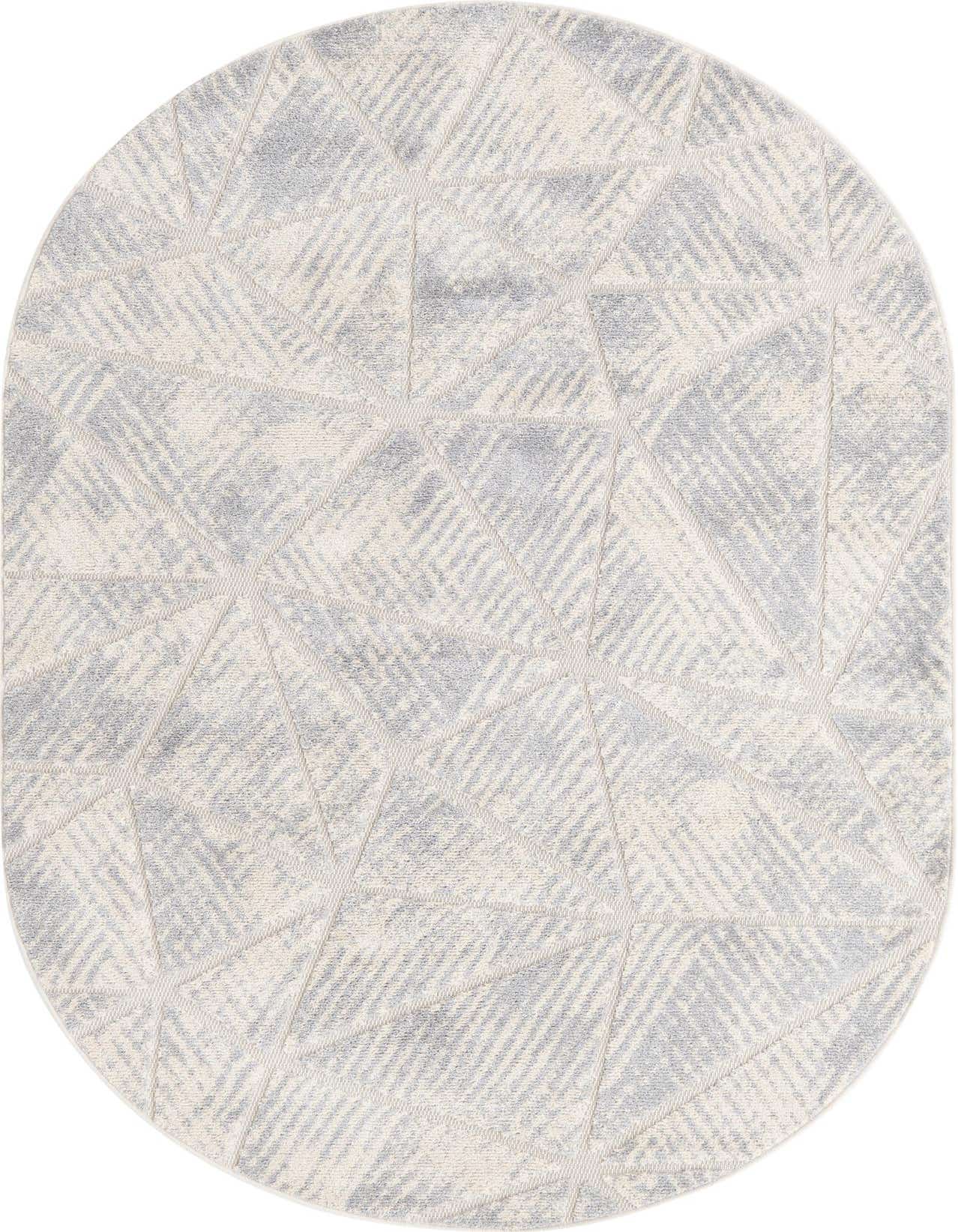 An oval ivory and cream rug with a modern geometric pattern of textured triangles, suitable for a living room.