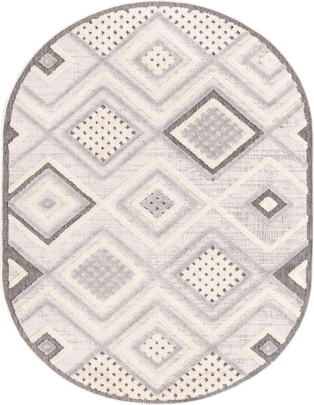 An oval Arlo rug in ivory and cream with a modern geometric diamond pattern and textured high/low pile.