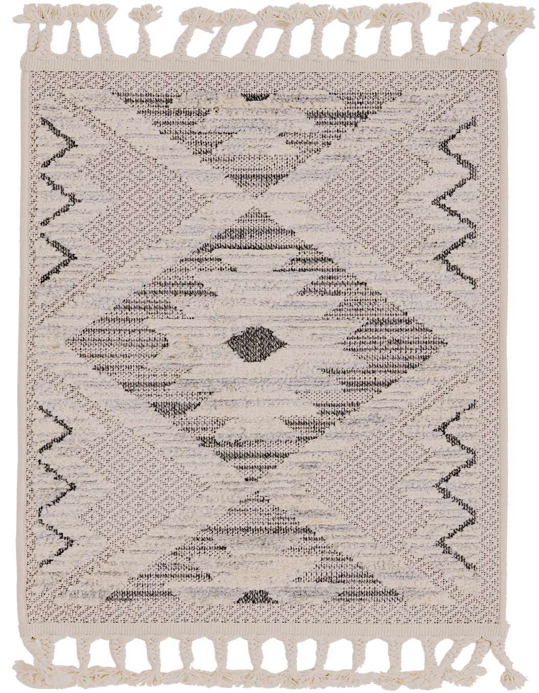 A 2x3 rectangular ivory and cream rug with a modern Southwestern tribal pattern and decorative tassels.