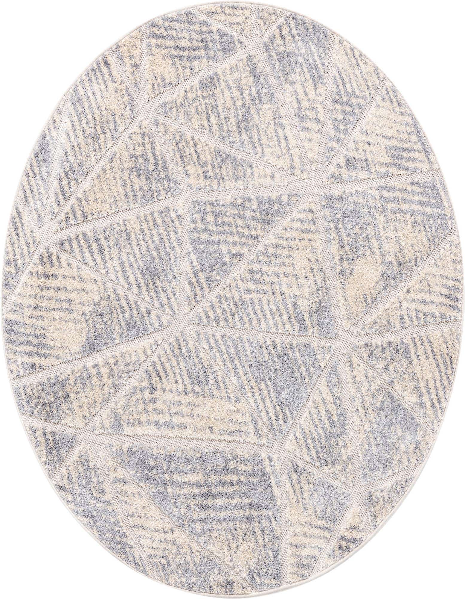 A 5' 3 round ivory and cream rug with a modern geometric pattern, featuring a textured high-low pile.