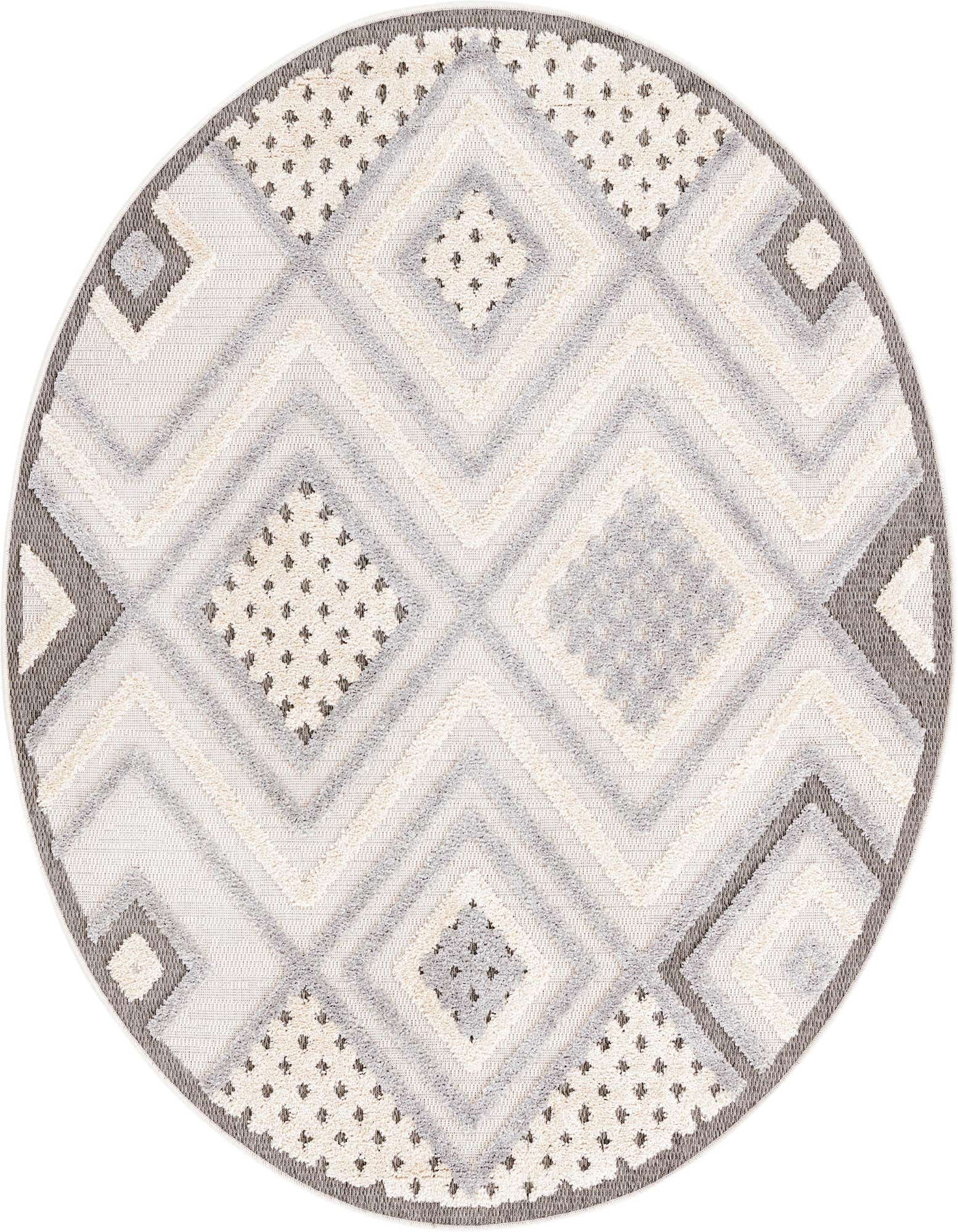 A 5' 3 round ivory and cream rug with a modern abstract pattern of textured diamonds and zigzags.