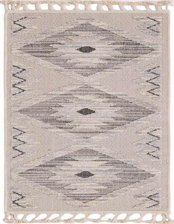 A 6 ft runner rug featuring a Southwestern tribal pattern in ivory, cream, and gray, with decorative tassels.