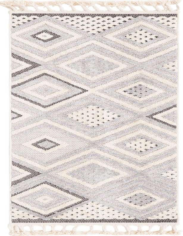 A 6 ft runner rug featuring a modern abstract diamond pattern in ivories, creams, and grays, with textured high/low pile and decorative tassels.