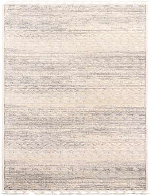 A 16 ft runner rug with a modern tribal pattern in ivories, creams, and whites, featuring textured pile.