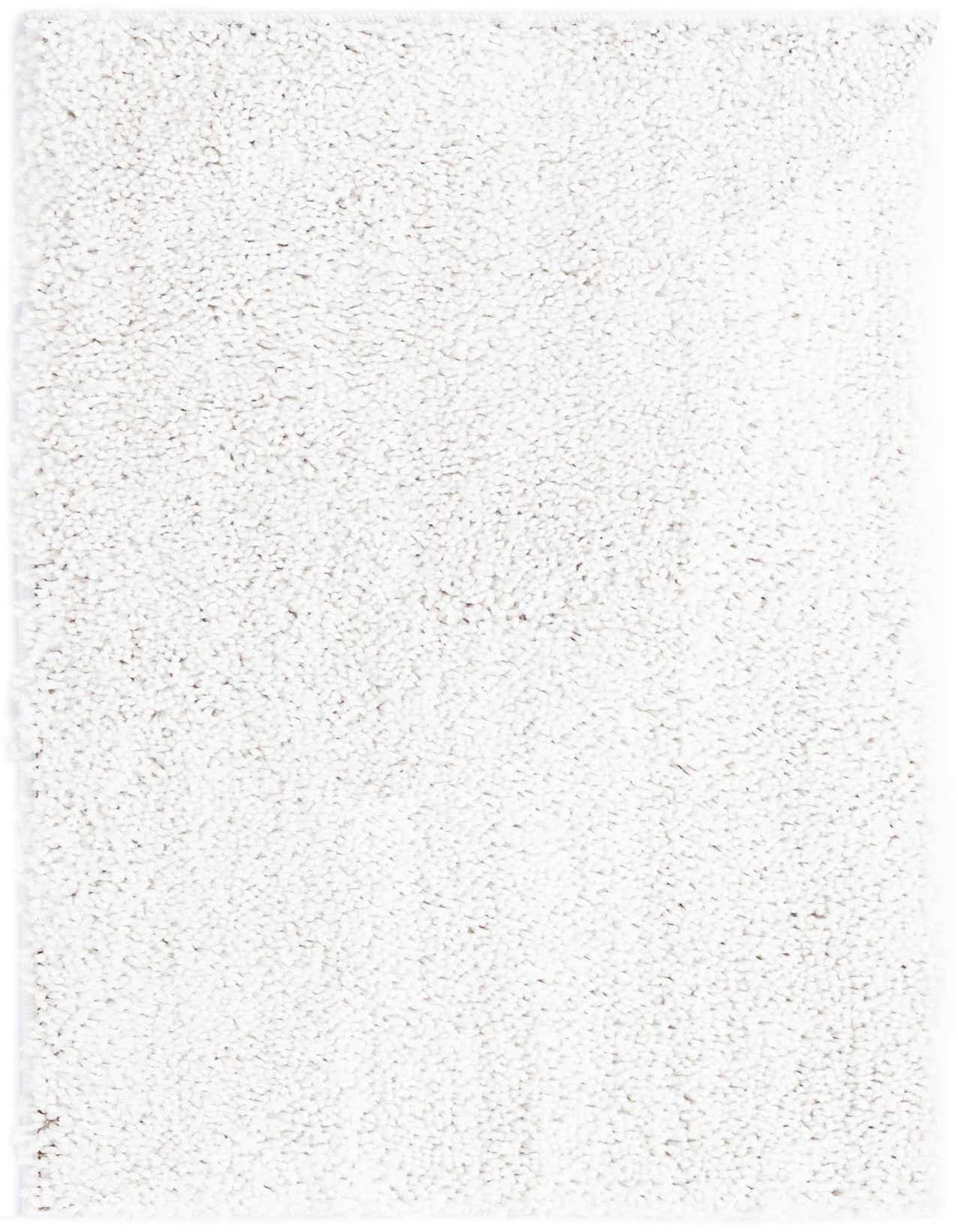 A close-up view of a 2x3 rectangular ivory shag rug, showcasing its soft, textured pile.