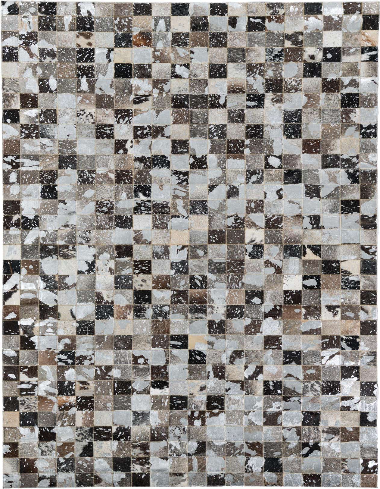 A 5x8 rectangular Cowhide & Leather rug featuring a modern, abstract patchwork design in varying shades of grays and silvers.