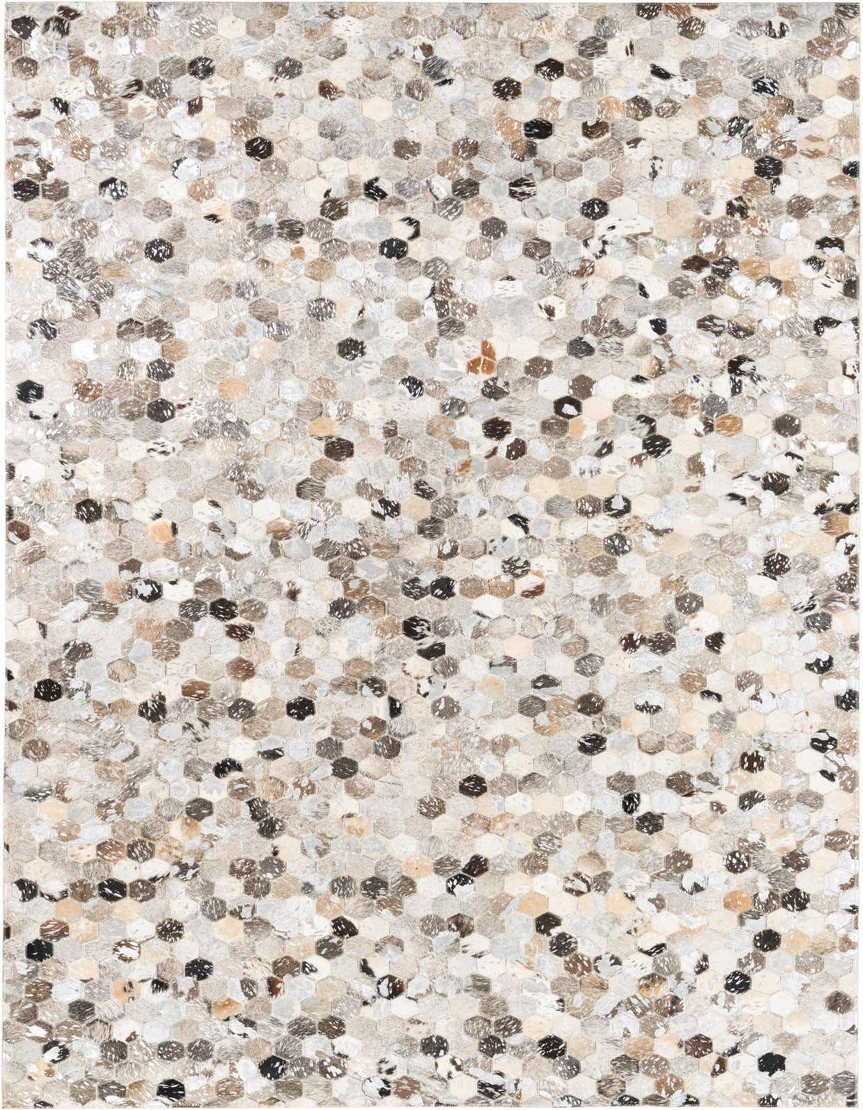 A 5x8 rectangular rug featuring a modern, abstract pattern of small hexagonal cowhide and leather patches in varying shades of gray, silver, brown, and off-white.