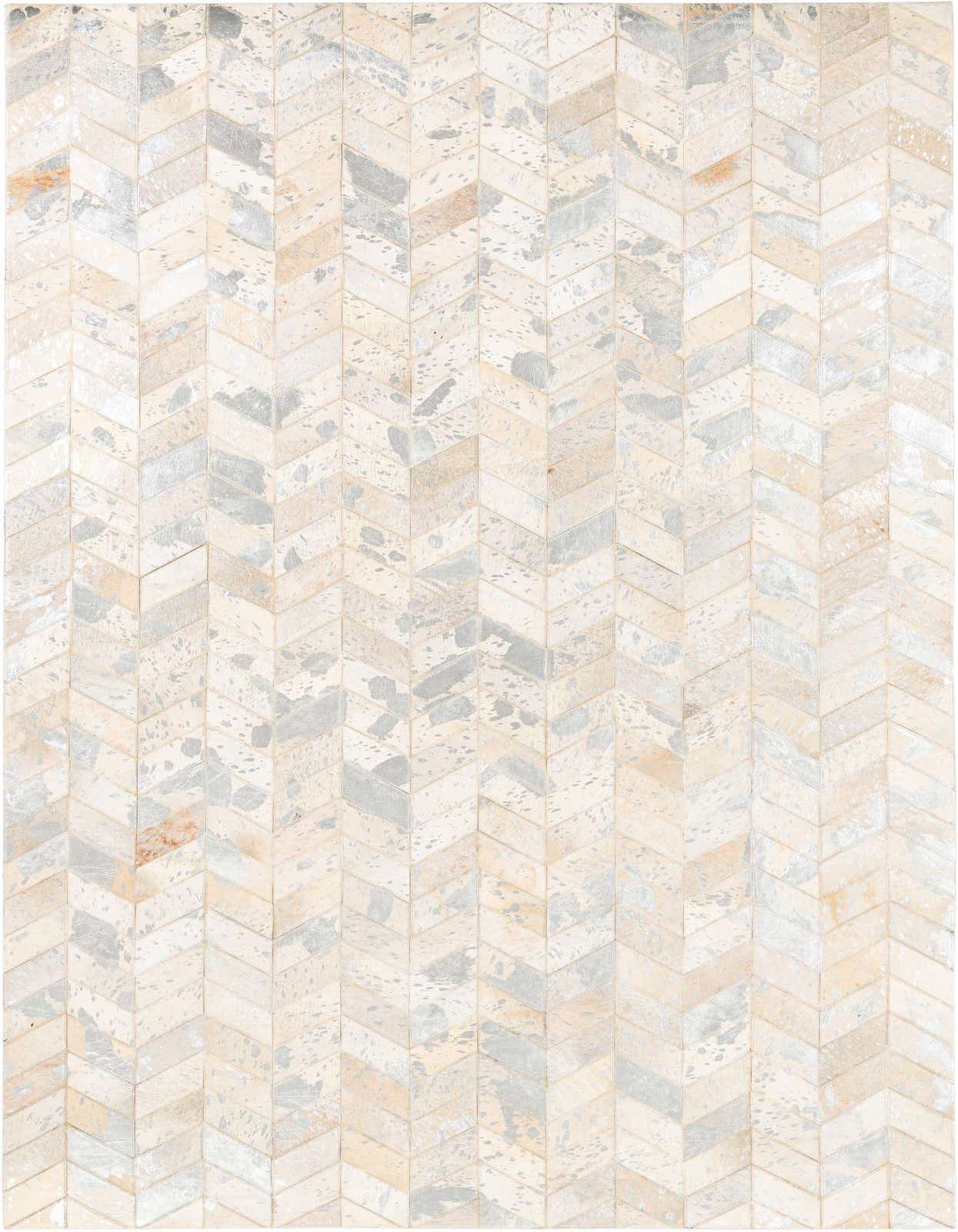 A 5x8 rectangular Cowhide Leather rug featuring a modern chevron pattern in shades of gray, silver, and cream.