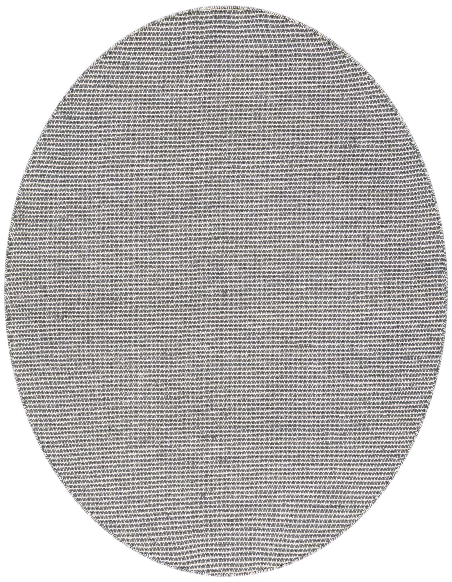 A 5'1" round silver stars modern flatweave rug made from recycled materials, suitable for indoor/outdoor use.