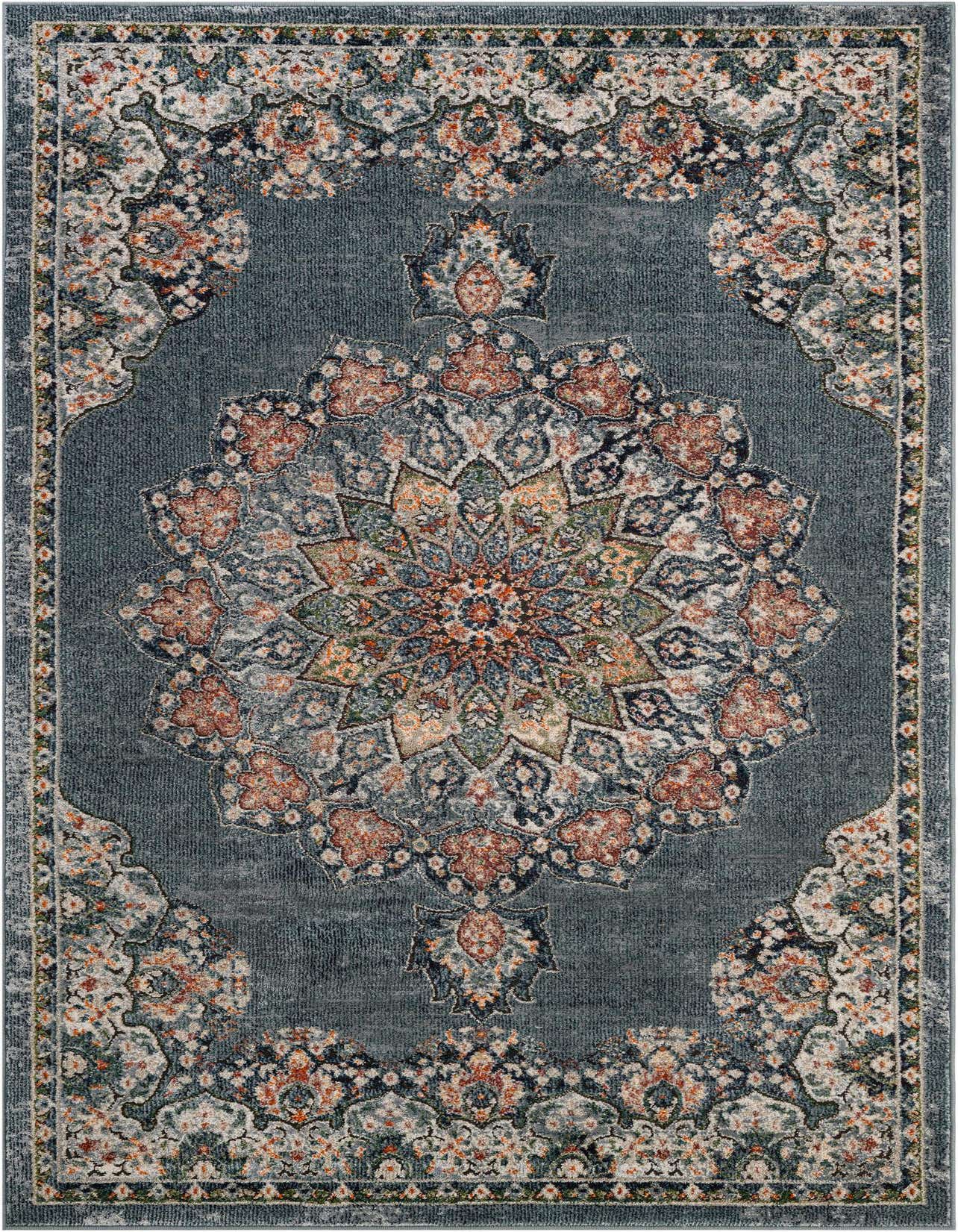A 5x8 rectangular Isabella Collection rug in varying shades of blue, featuring an intricate central medallion and border with floral patterns in blue, orange, and cream.