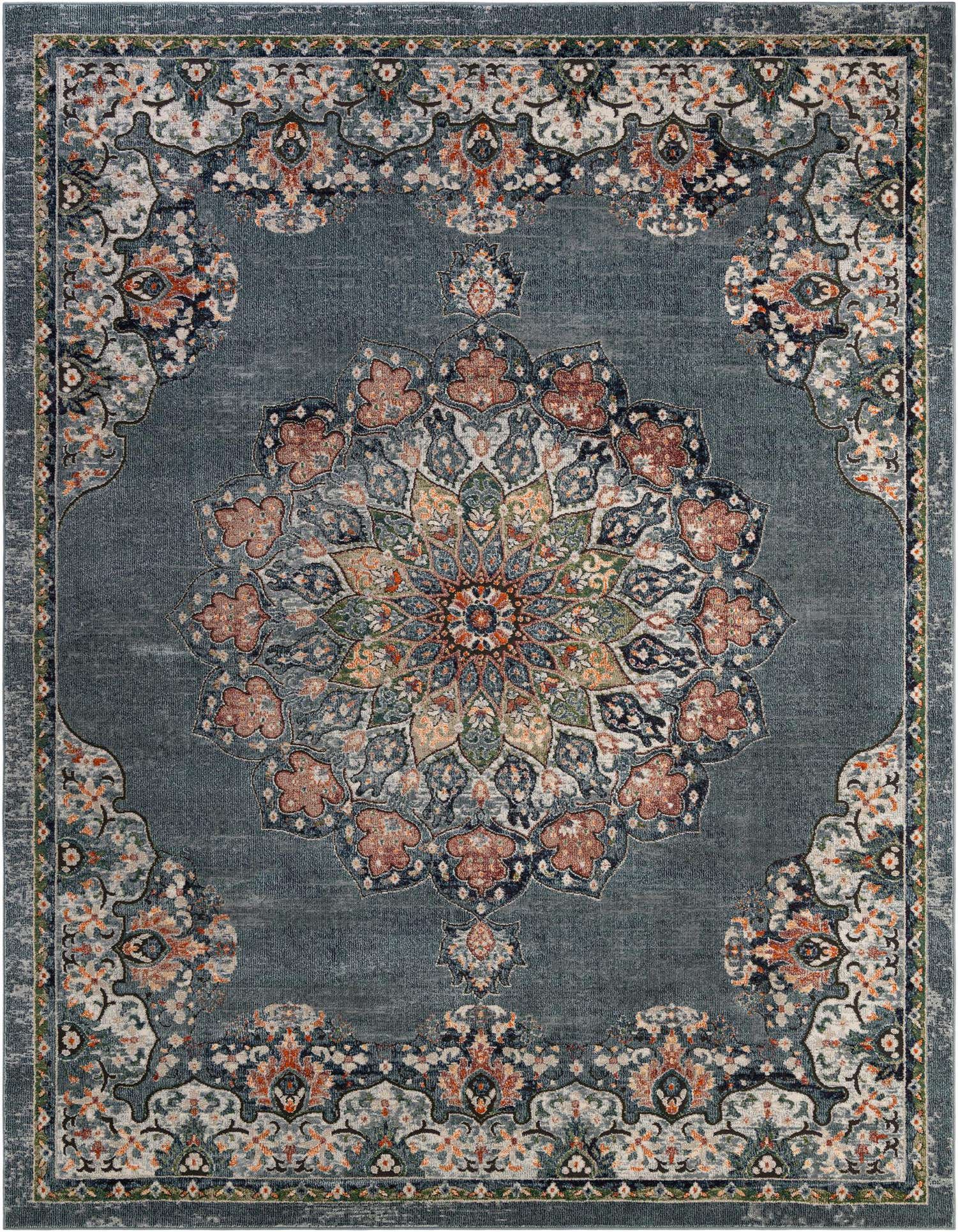 A 9x12 rectangular Isabella collection rug in shades of blue with an intricate floral medallion pattern.