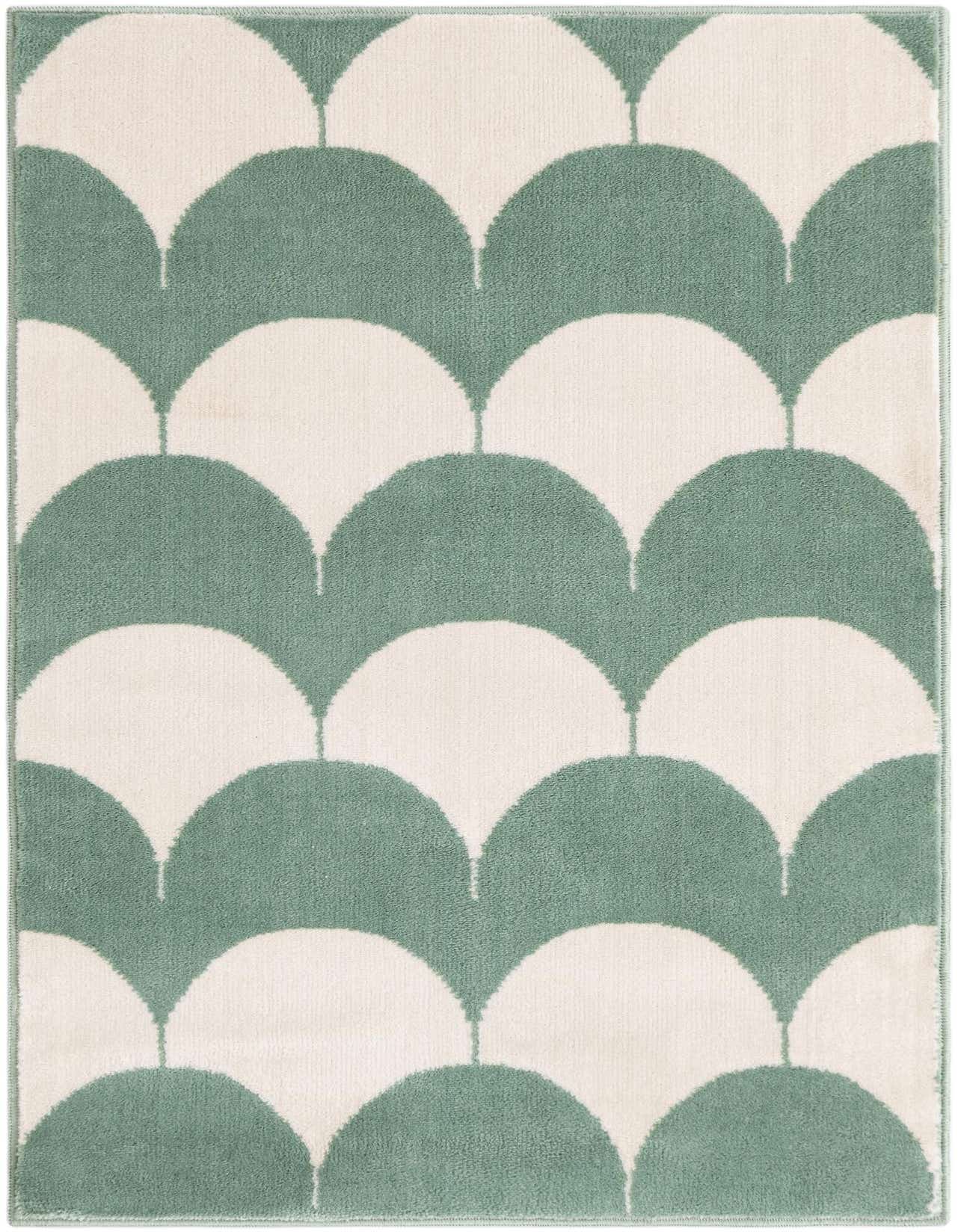A 2x3 rectangular rug featuring a modern abstract pattern of soft green half-circles on a cream background.