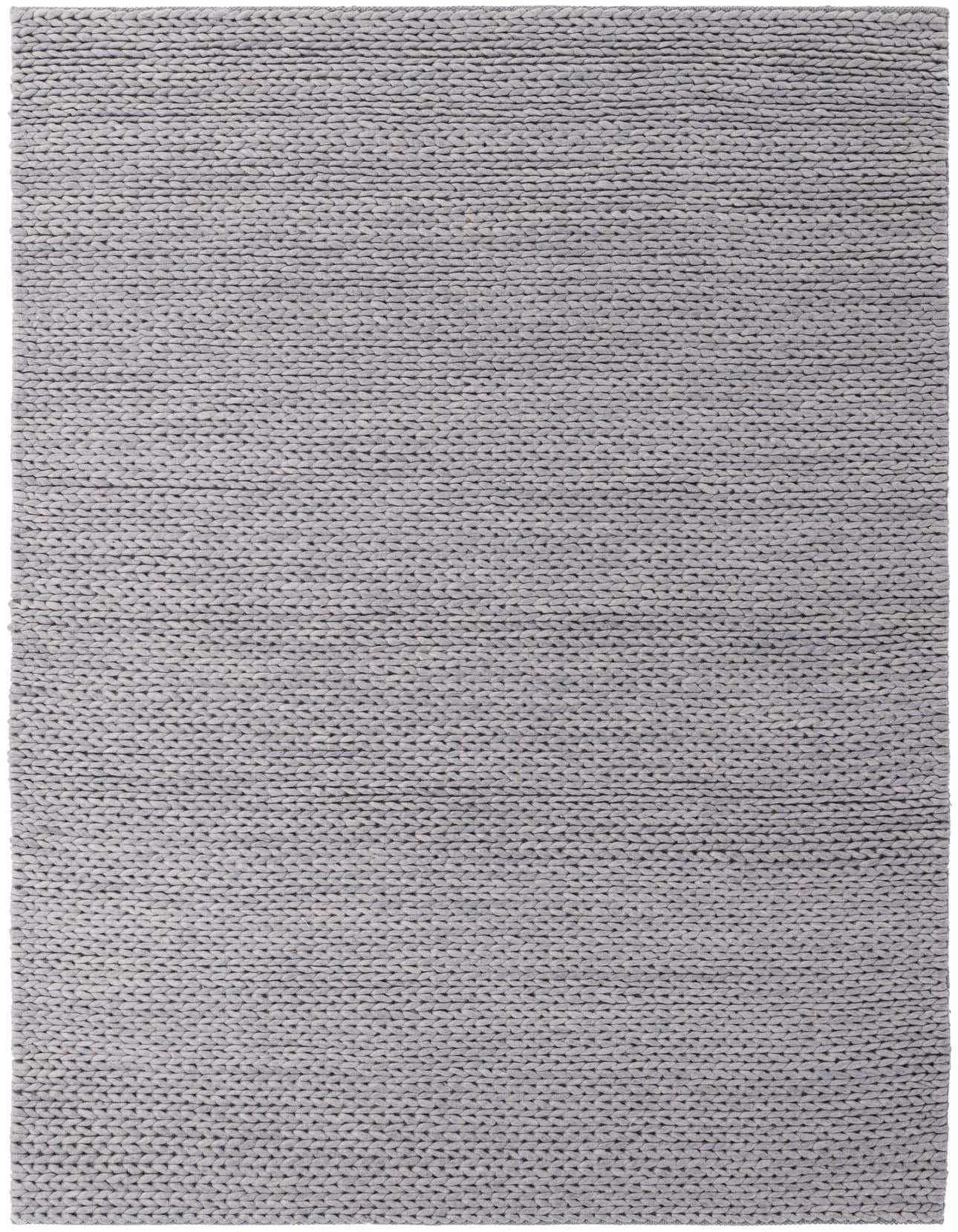 A 5x8 rectangular gray modern area rug made of New Zealand wool, featuring a solid, hand-knitted texture.