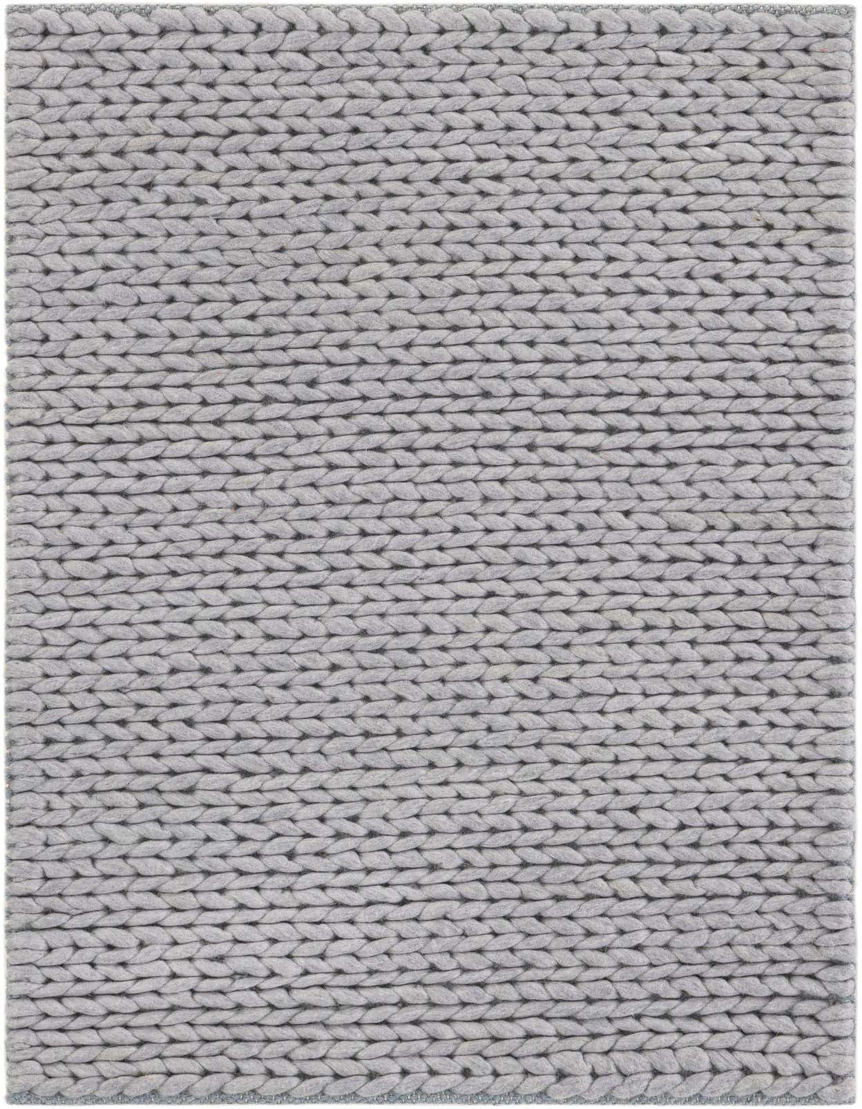 A 2x3 rectangular gray modern area rug with a thick, textured, hand-knitted New Zealand wool pile.