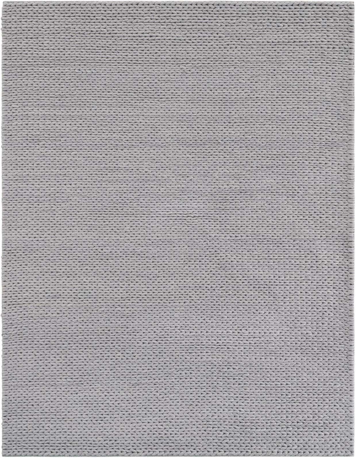 A 5x8 rectangular gray New Zealand wool rug with a modern, textured, solid knit pattern, perfect for a living room.