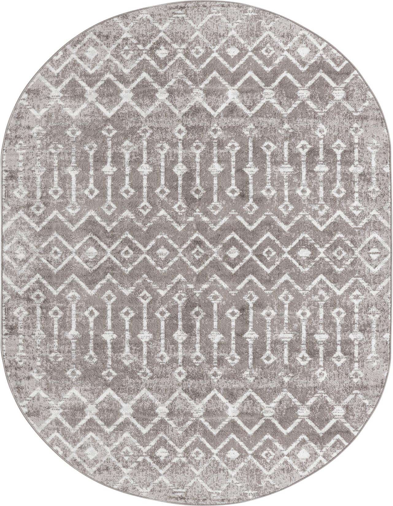 An oval 5' 3 x 8' 0 gray polypropylene rug with a distressed white bohemian trellis pattern.