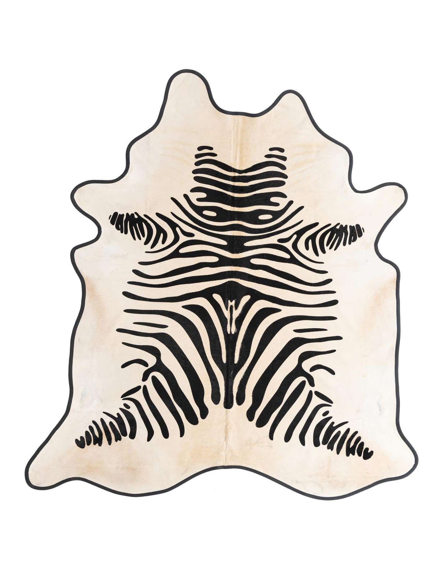 A 5' 8 x 6' 9 freeform cowhide rug with a cream and tan base and bold black zebra stripes.