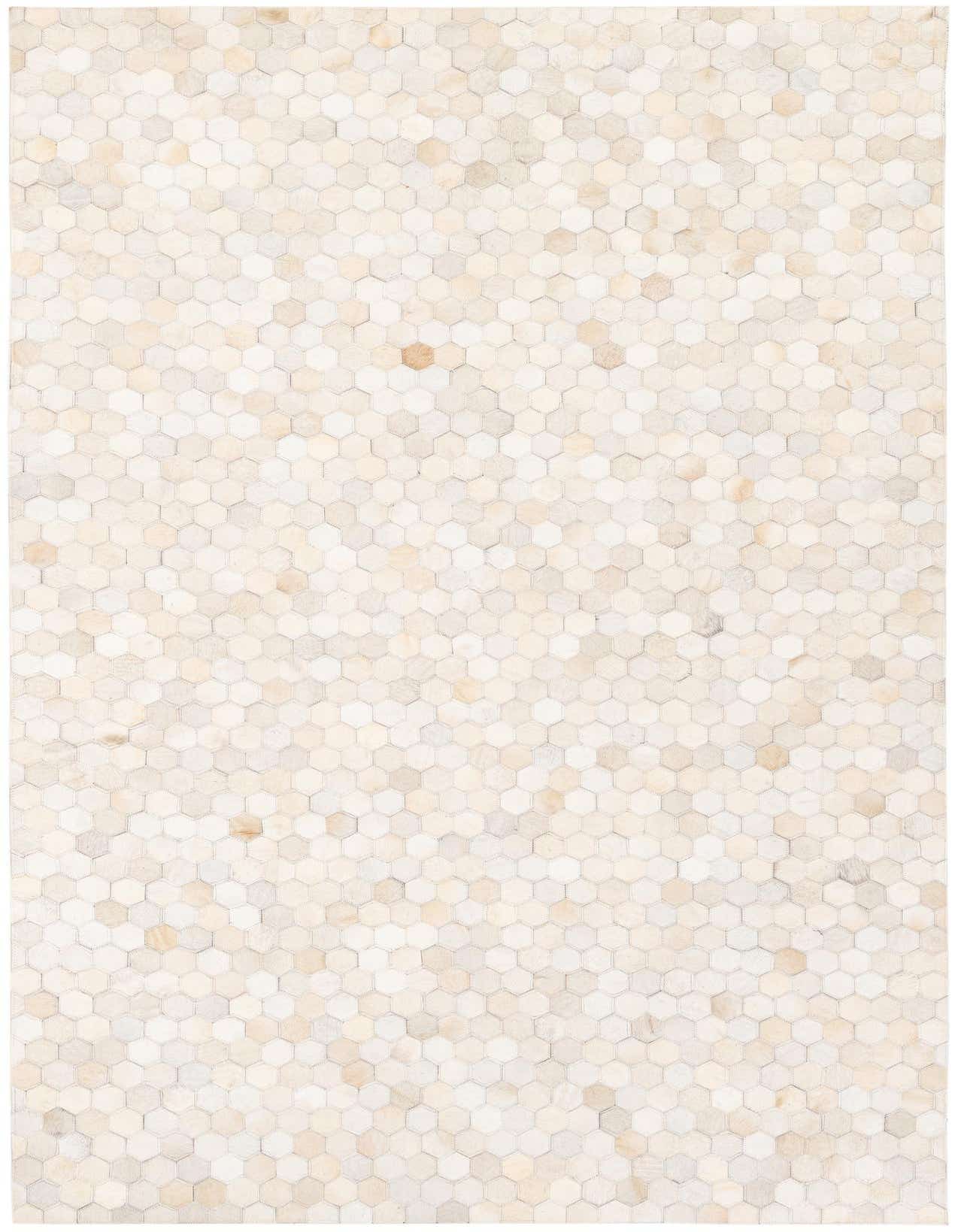 A 5x8 rectangular Cowhide Stocks rug featuring a geometric patchwork of brown, tan, and cream hexagonal cowhide pieces.