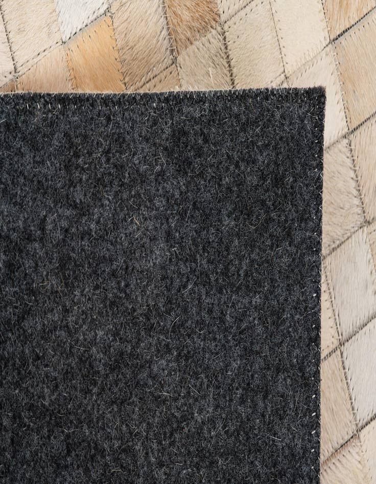 Detail image of  5' x 7' 11 Cowhide Stocks Rug