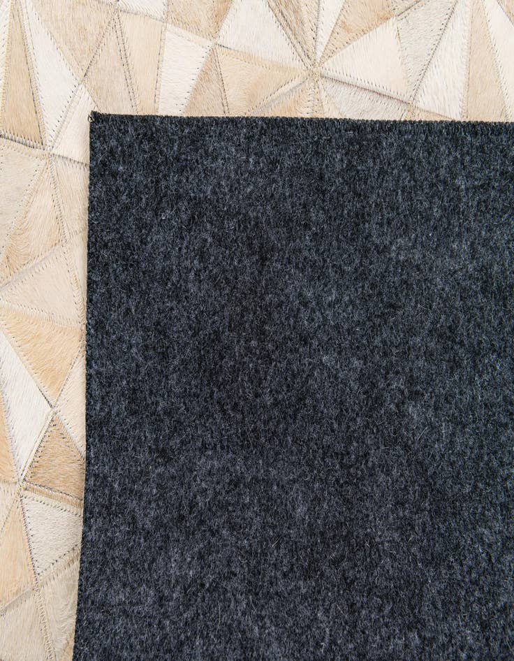 Detail image of  3' 11 x 6' Cowhide Stocks Rug